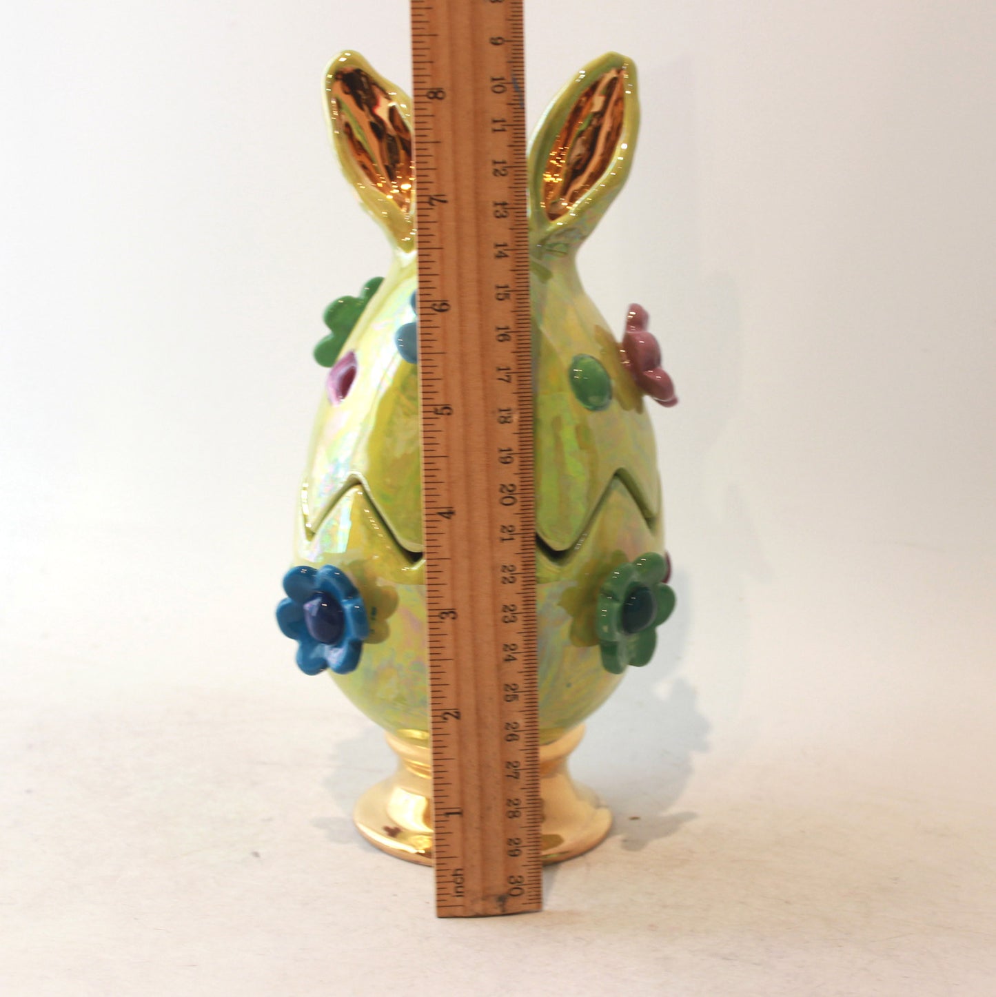 Easter Egg in Green with Ears Daisies and Bobbles