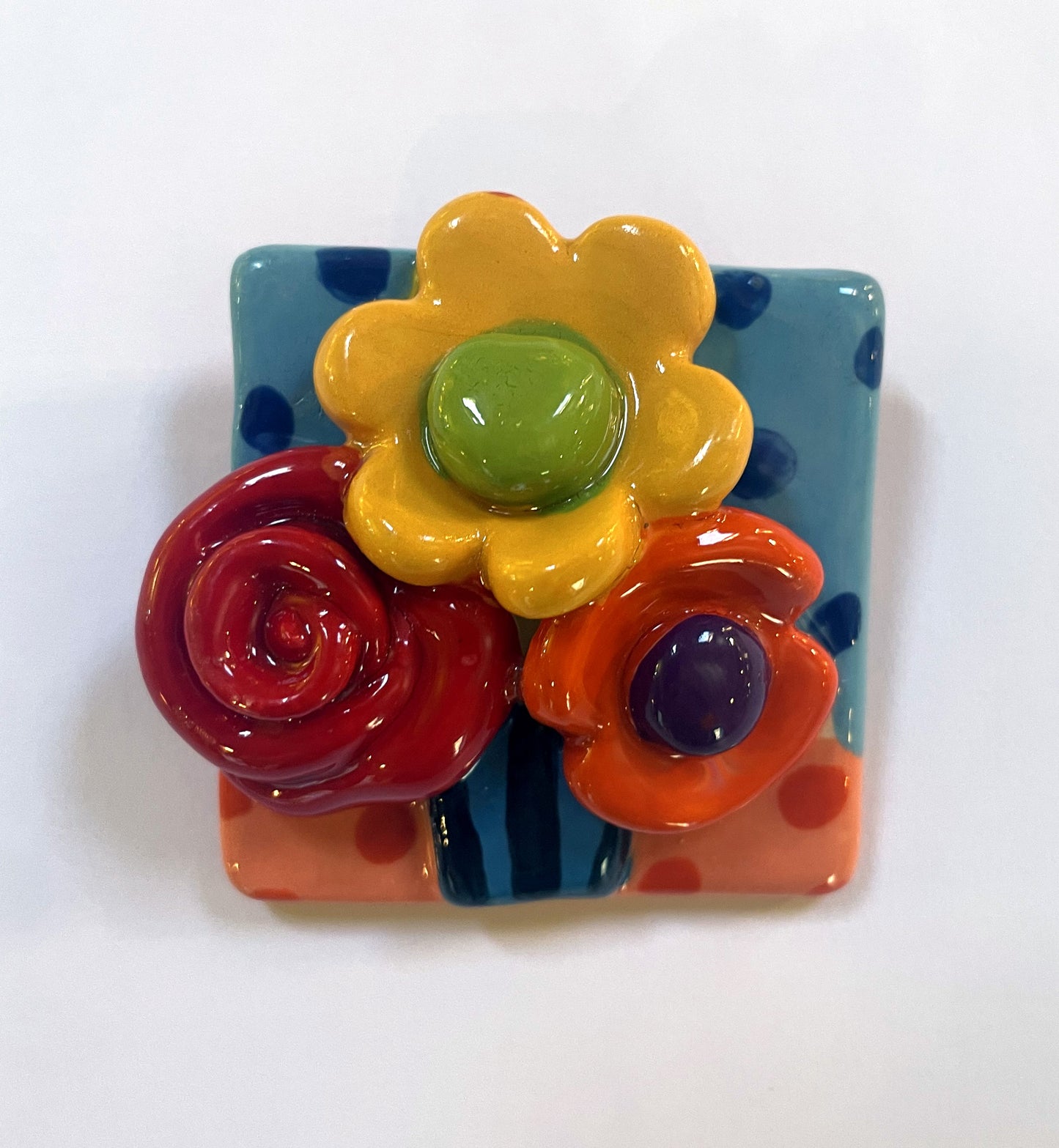 Brooch with Blue and Peach Background