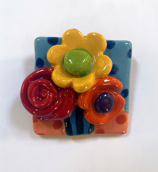 Brooch with Blue and Peach Background