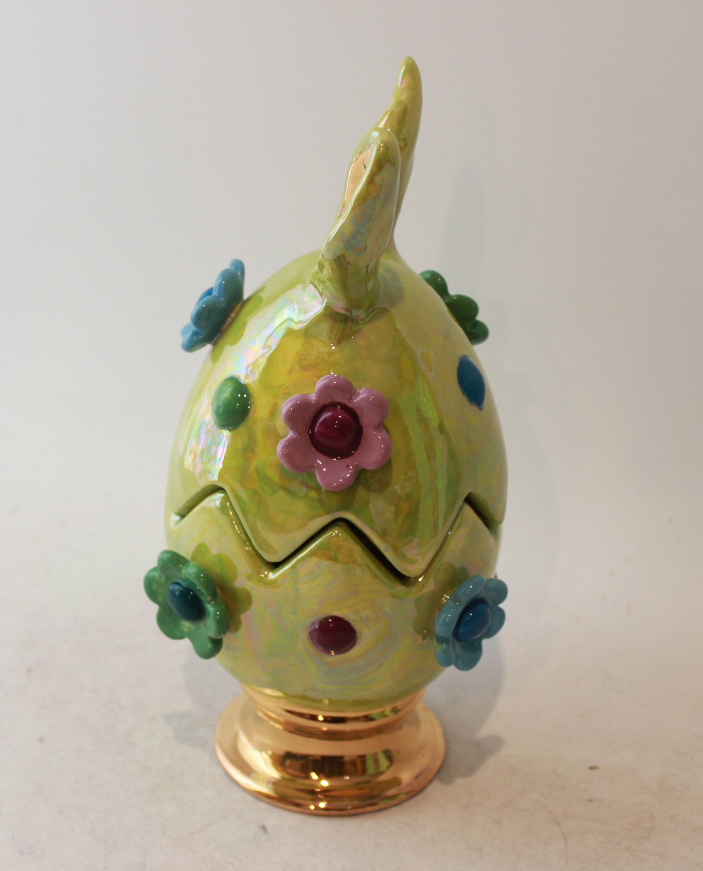 Easter Egg in Green with Ears Daisies and Bobbles