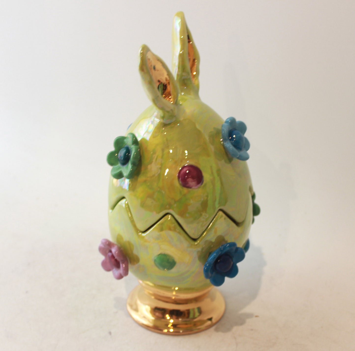 Easter Egg in Green with Ears Daisies and Bobbles