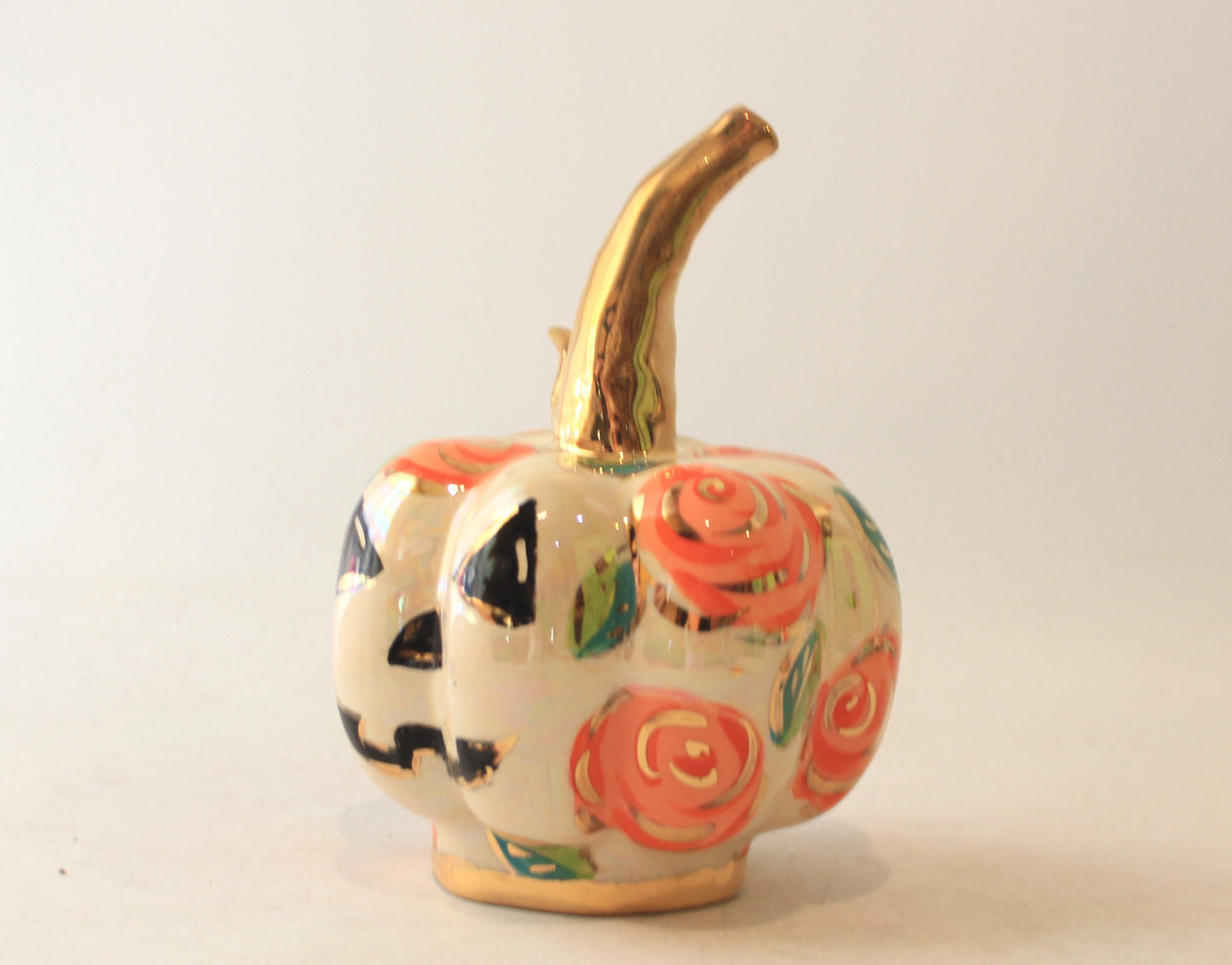 Small Pumpkin with Face and Orange Roses