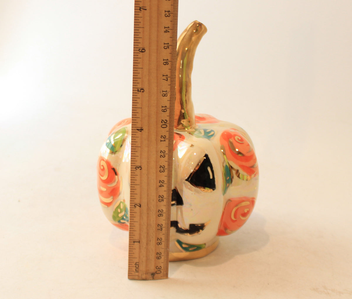 Small Pumpkin with Face and Orange Roses